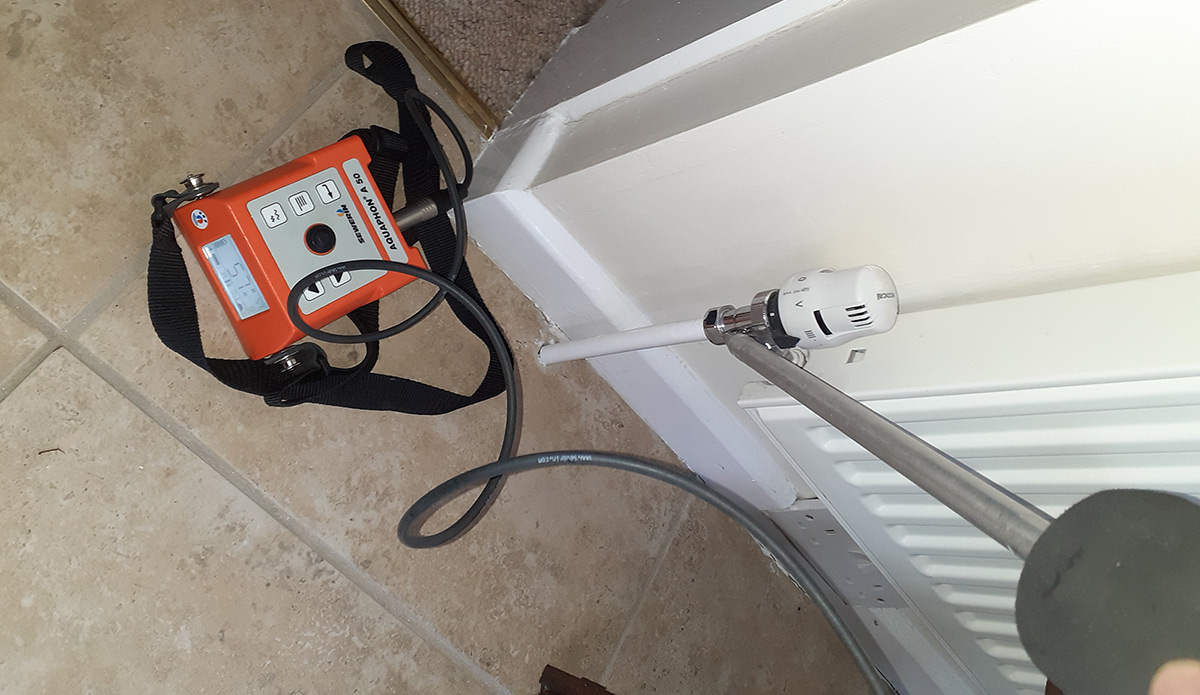 Acoustic leak detection equipment used to locate a concealed pipe leak