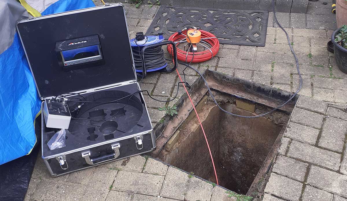 CCTV drain survey camera inspecting underground drainage pipework