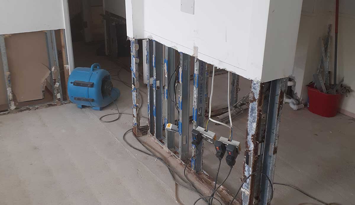 Industrial air movers being used during structural drying