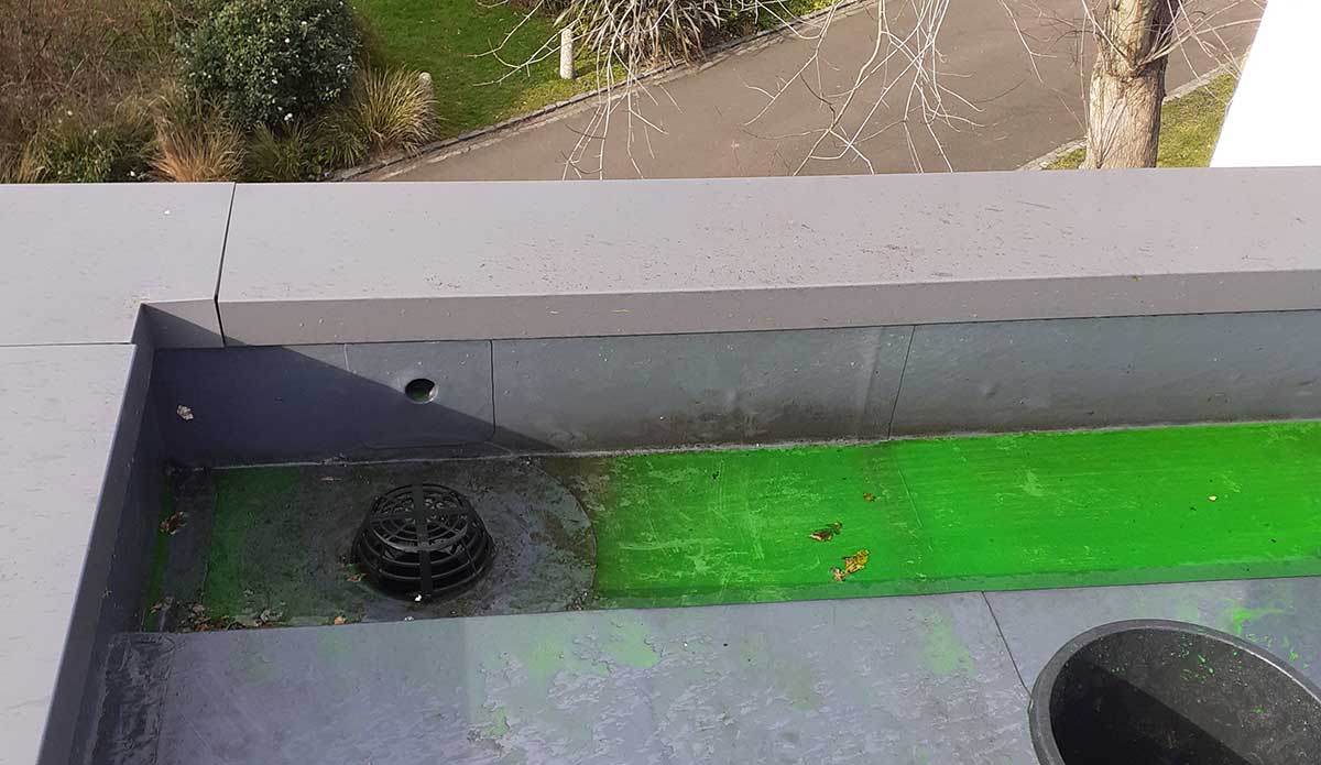 Specialist flat roof leak detection testing on a waterproof membrane